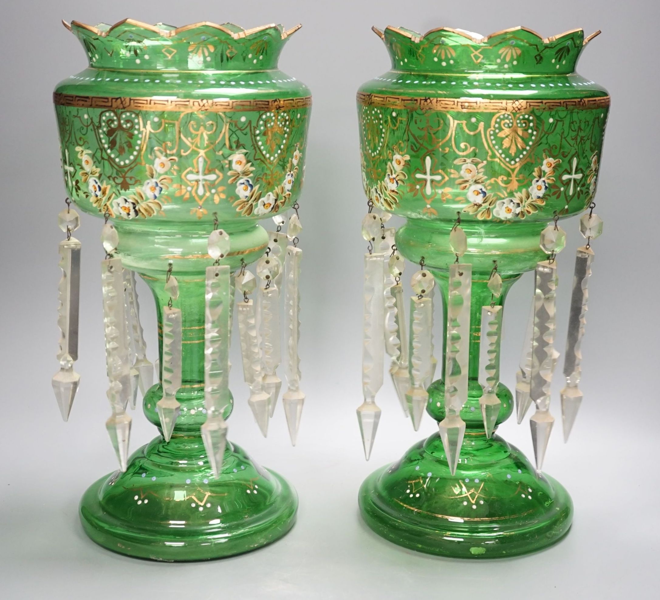 A pair of late 19th century green glass enamel lustres - 37cm high